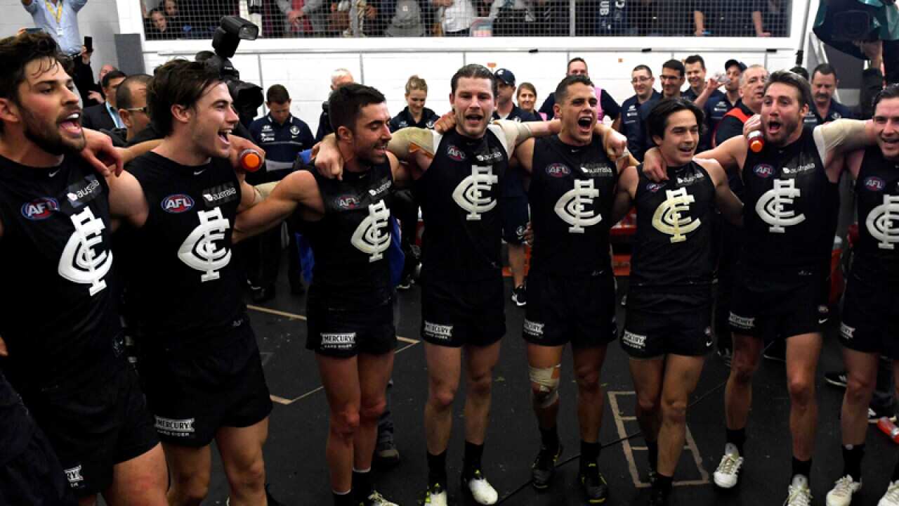 Carlton Blues players sing the team song