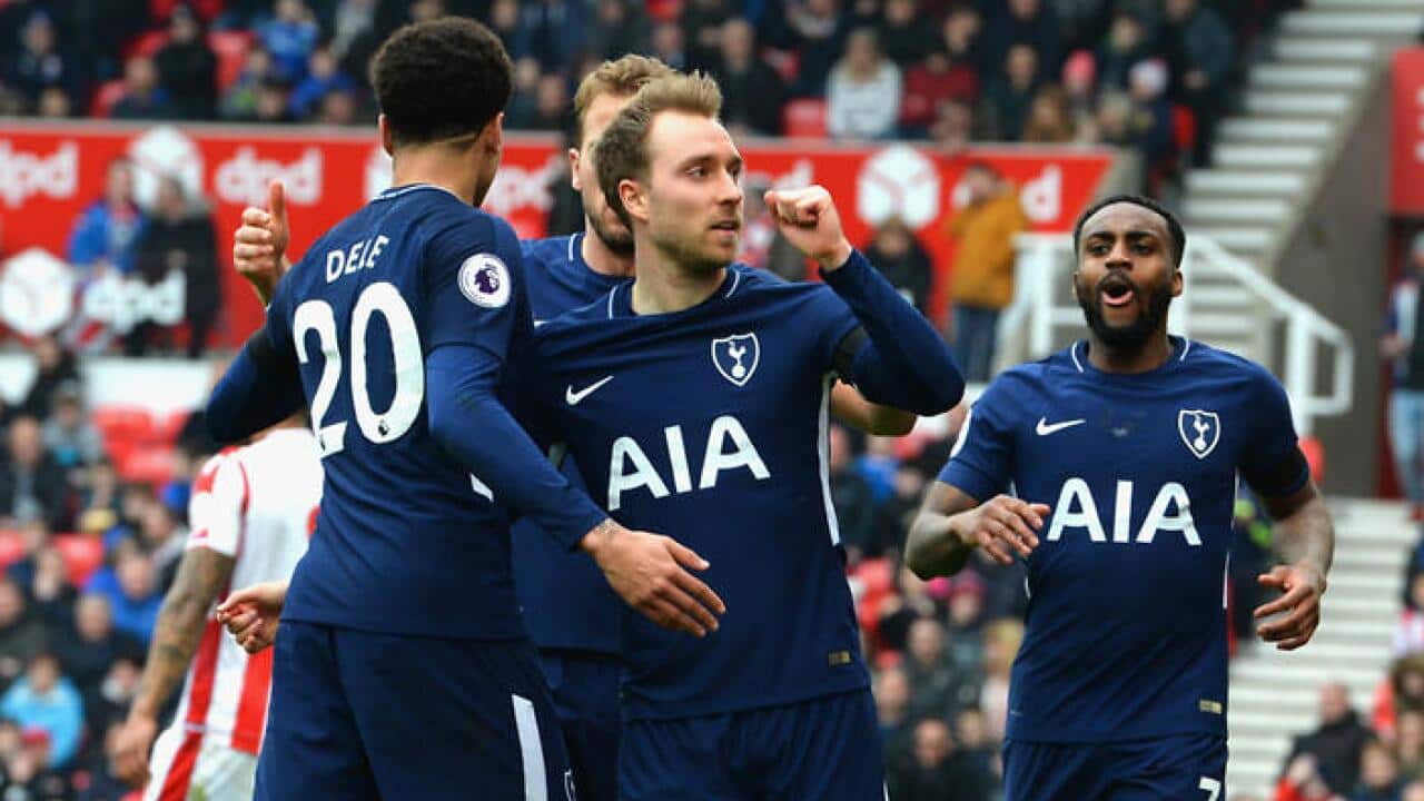 Christian Eriksen (C) celebrates a goal for Tottenham Hotspur