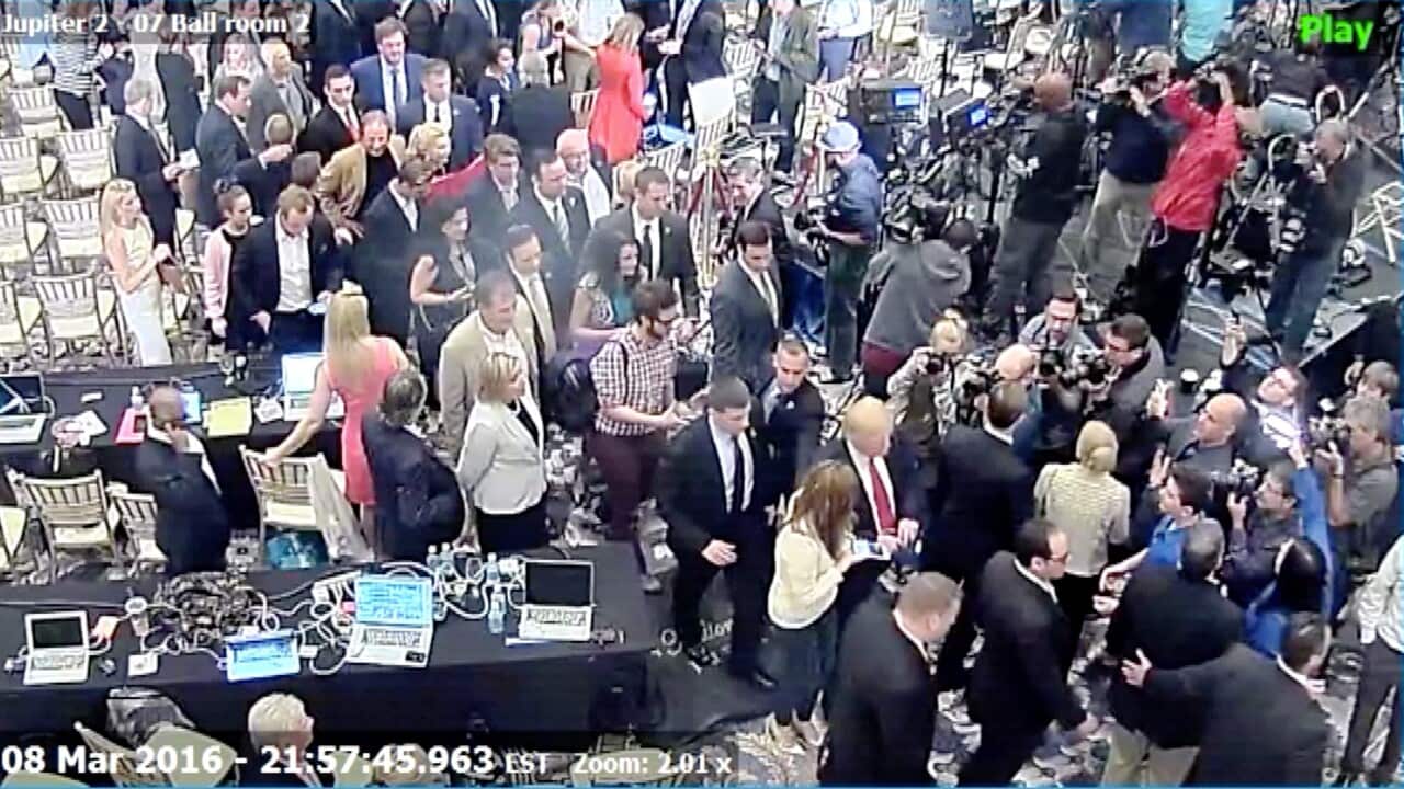 Manager Corey Lewandowski allegedly grabbed former Breitbart reporter Michelle Fields (wearing white shirt at bottom C next to Trump in dark suit and red tie)