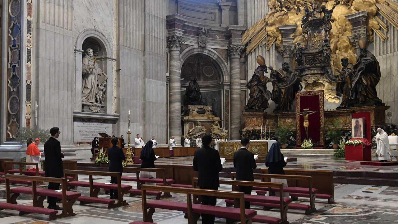 Pope Francis celebrates the Easter Mass on Holy Sunday behind closed doors in Saint Peters Basilica at the Vatican
