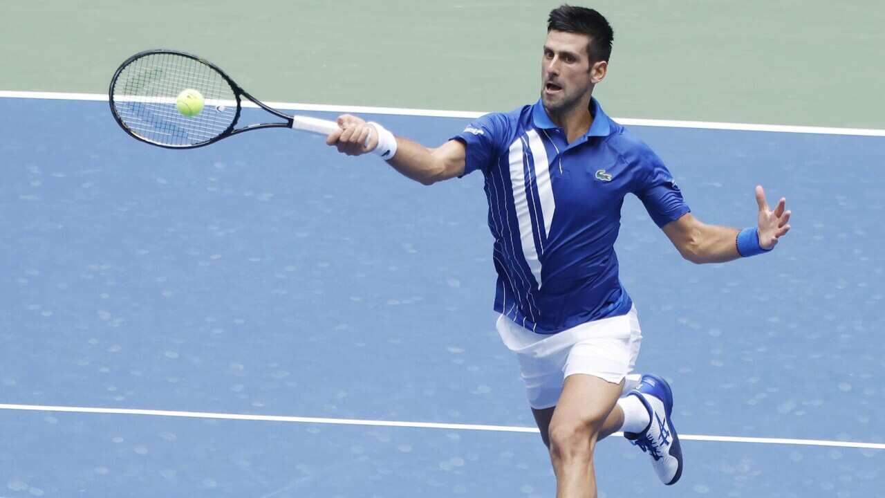 Novak Djokovic of Serbia hits a return to Kyle Edmund of Great Britain during their match on the third day of the US Open Tennis Championships the USTA National Tennis Center in Flushing Meadows, New York, USA, 02 Septemeber 2020.