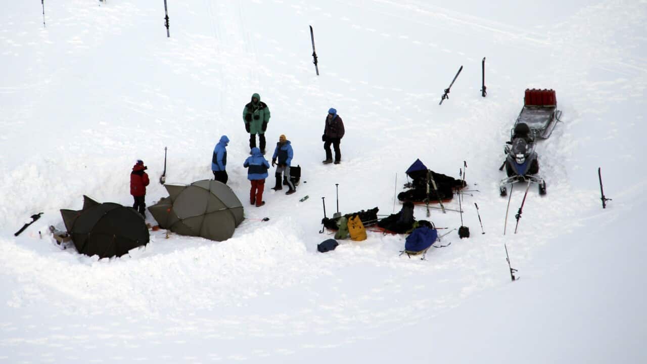 Tourists stand in the camp where a polar bear attacked in Svalbard, Norway Thursday March 19, 2015 . (AP Photo/Arild Lyssand Svalbard Police, NTB scanpix)