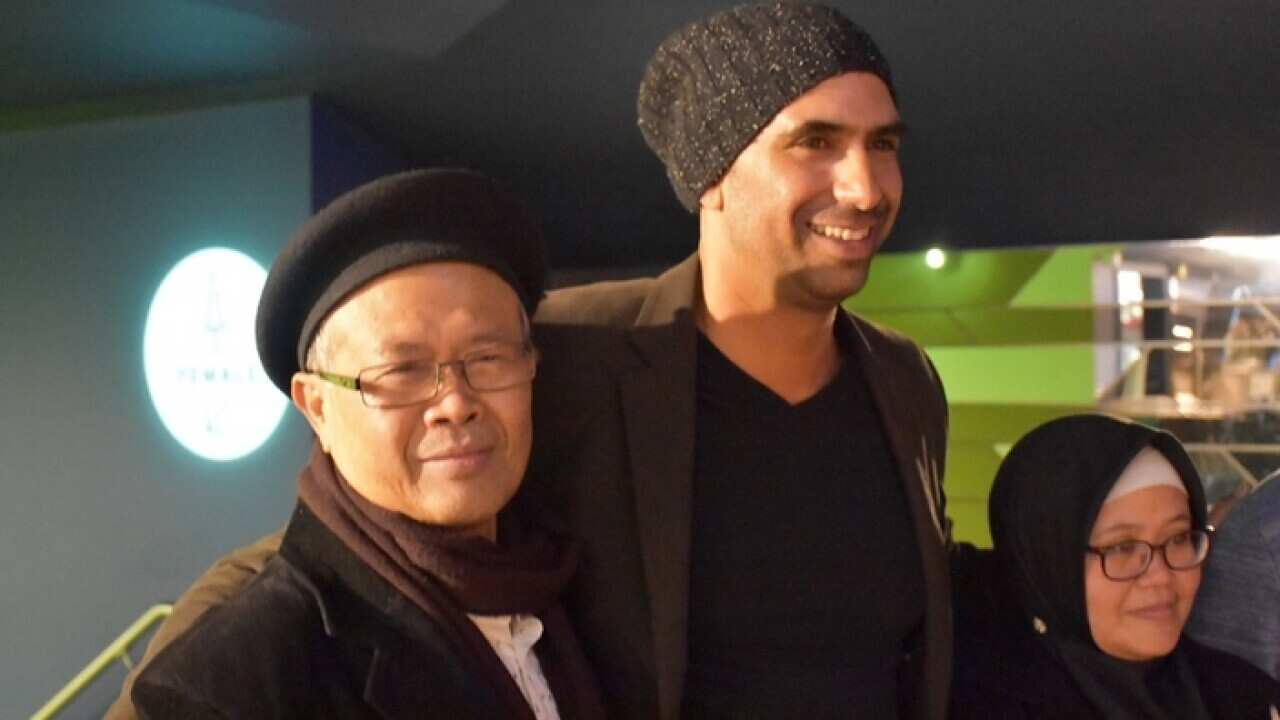 Actors Adam McConvell (centre) and Bela Kusumah (left) with student and activist Yuni Asriyanti after the screening of “Guilty” at the Lido cinema in Melbourne, Oct 10 2018.