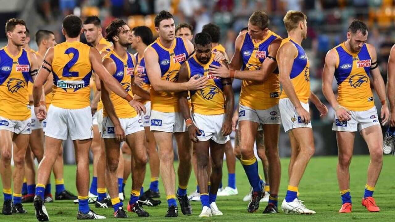 West coast players after losing to Brisbane.