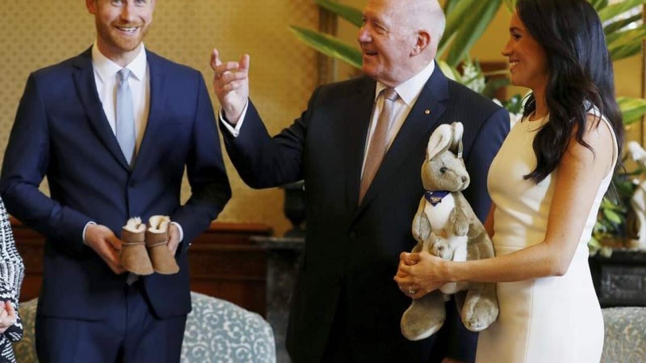 Meghan, Duchess of Sussex, and Prince Harry react.