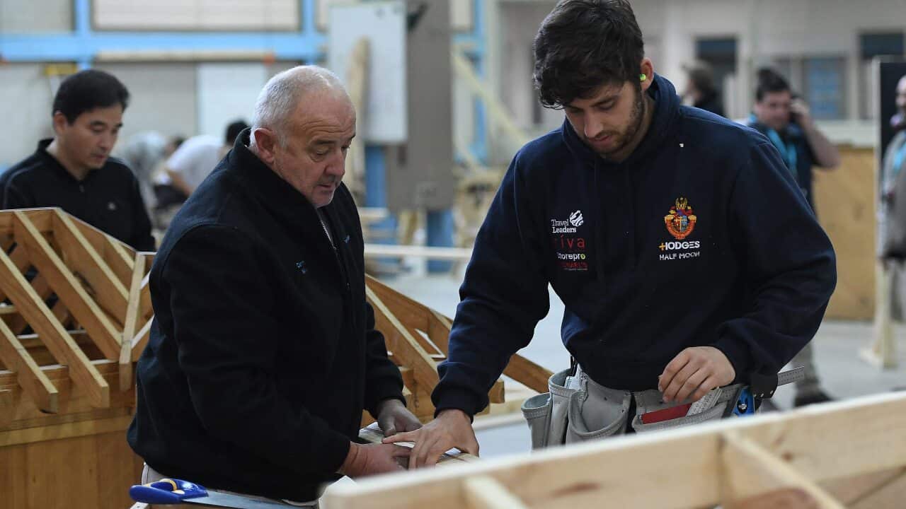 A master and apprentice carpenter at Holmesglen TAFE Chadstone campus in Melbourne. Tradies are set for a boost.