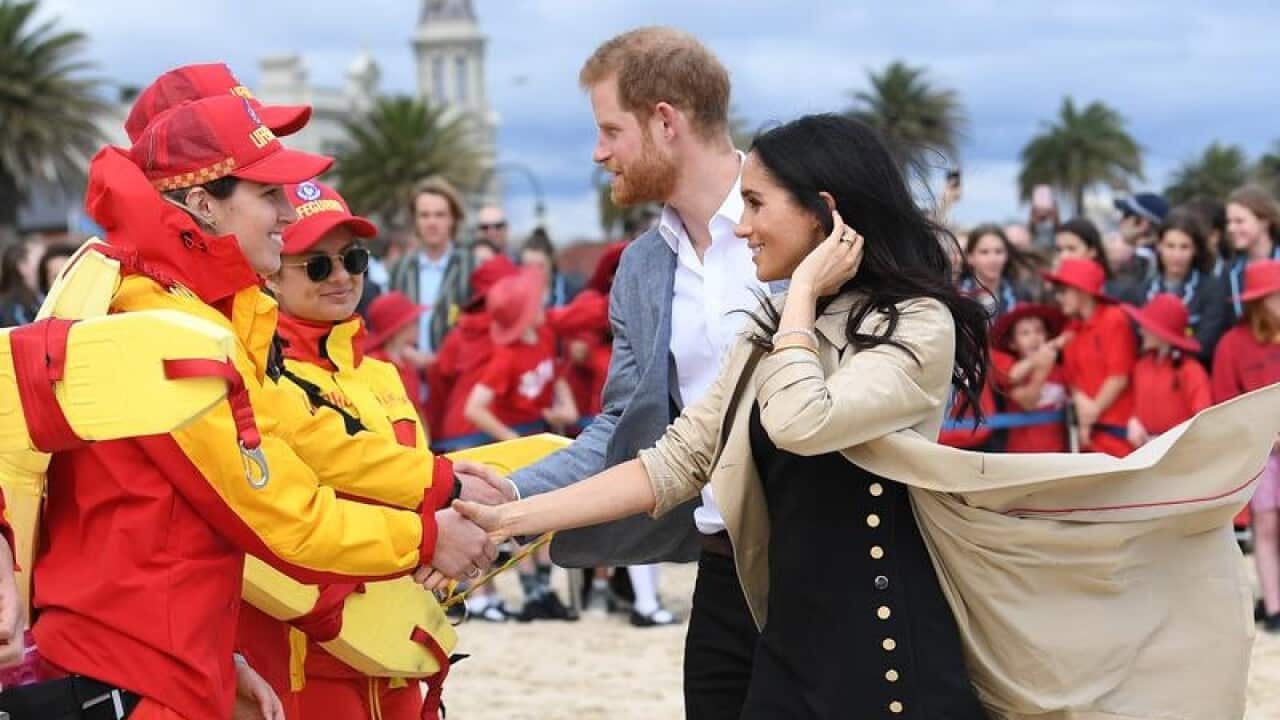 Prince Harry and Meghan meet lifesavers at South Melbourne Beach.