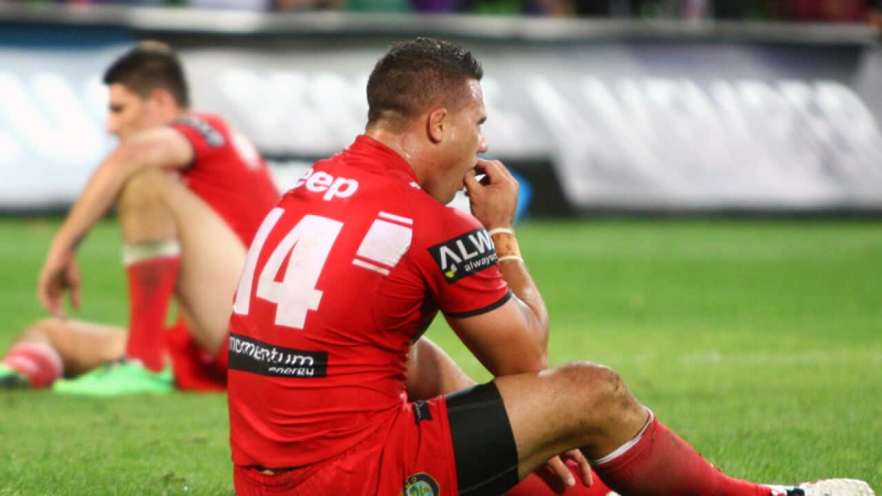 Dejected Dragons players after their loss to the Melbourne Storm