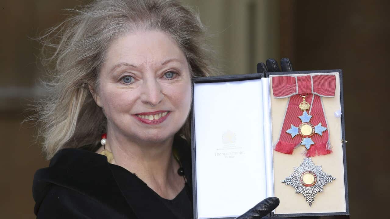 Dame Hilary Mantel holds her Dame Commander of the British Empire medal presented to her for services to literature at an Investiture ceremony at Buckingham Palace in central London.