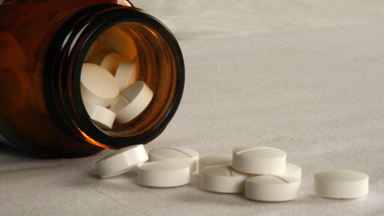 Tablets fall from a jar