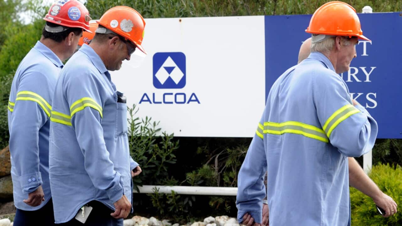 Workers enter the Alcoa aluminium smelter at Point Henry in Geelong