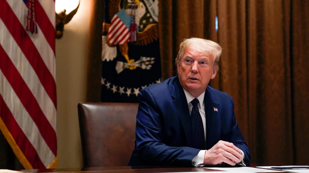 President Donald Trump listens during a meeting with Sen. Tim Scott, R-S.C., to talk about opportunity zones in the Cabinet Room of the White House, Monday, May 18, 2020, in Washington. (AP Photo/Evan Vucci)
