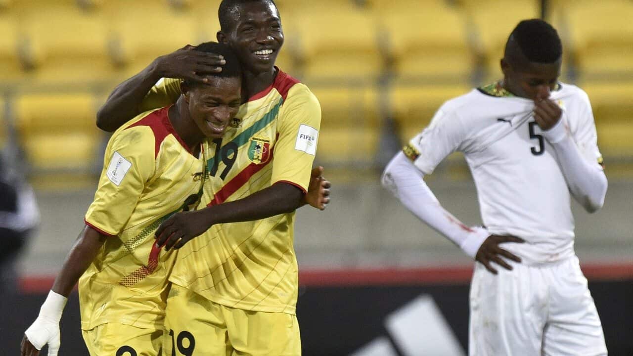 Adama Traore (C) and Souleymane Diarra of Mali
