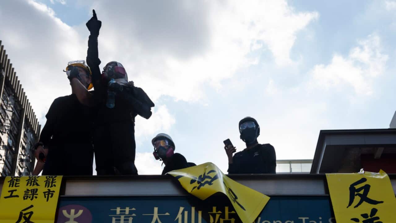 A protester points at the police during the demonstration in Hong Kong