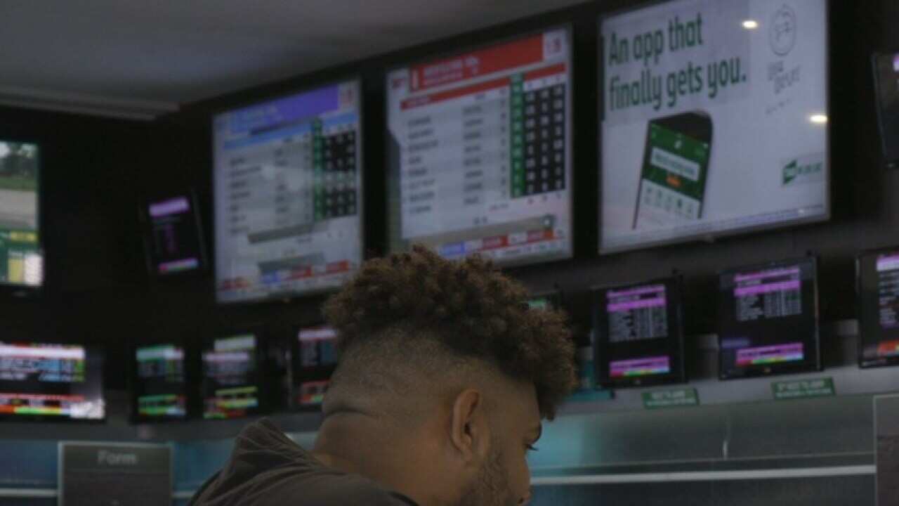 Craig Laundy behind the bar at the Horse and Jockey in Homebush, Sydney.