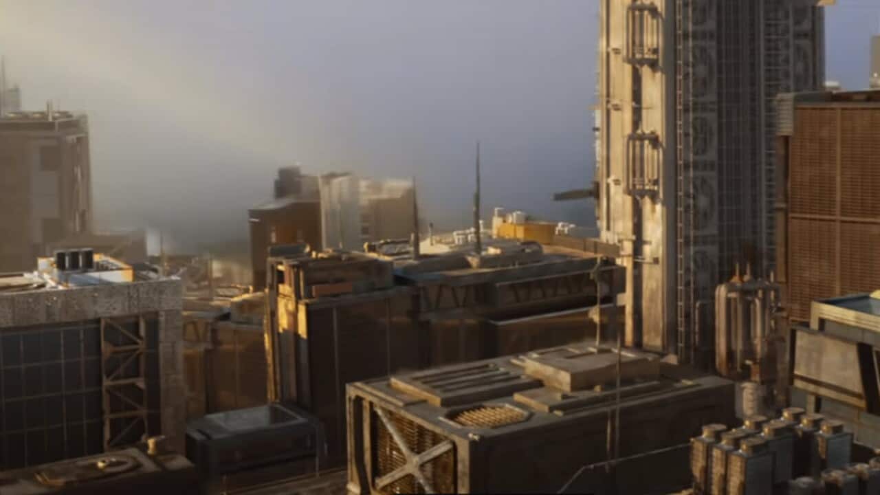 A screenshot of a movie showing a skyline just before the full force of a massive explosion impacts buildings.