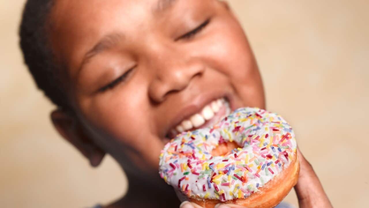 Woman eating a donut