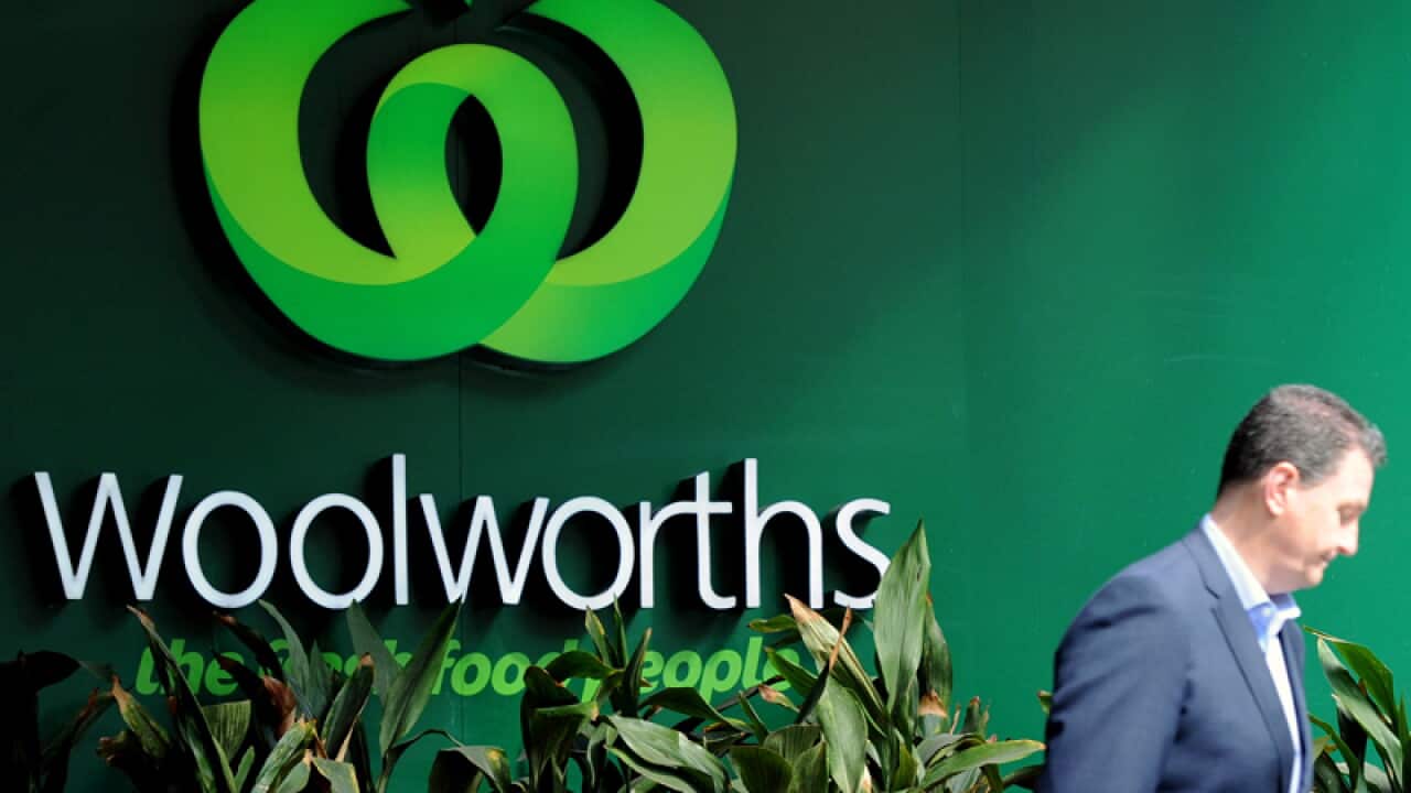 A Woolworths logo outside a supermarket