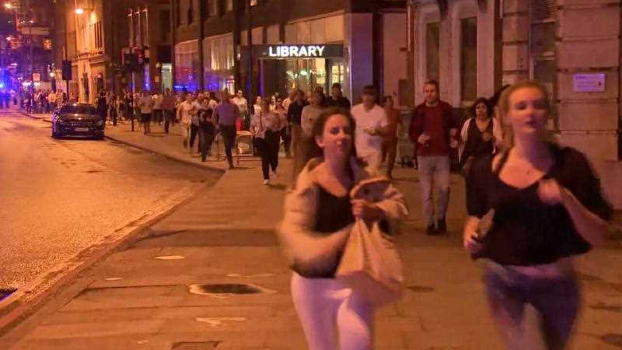 People run from the scene an attack in London.