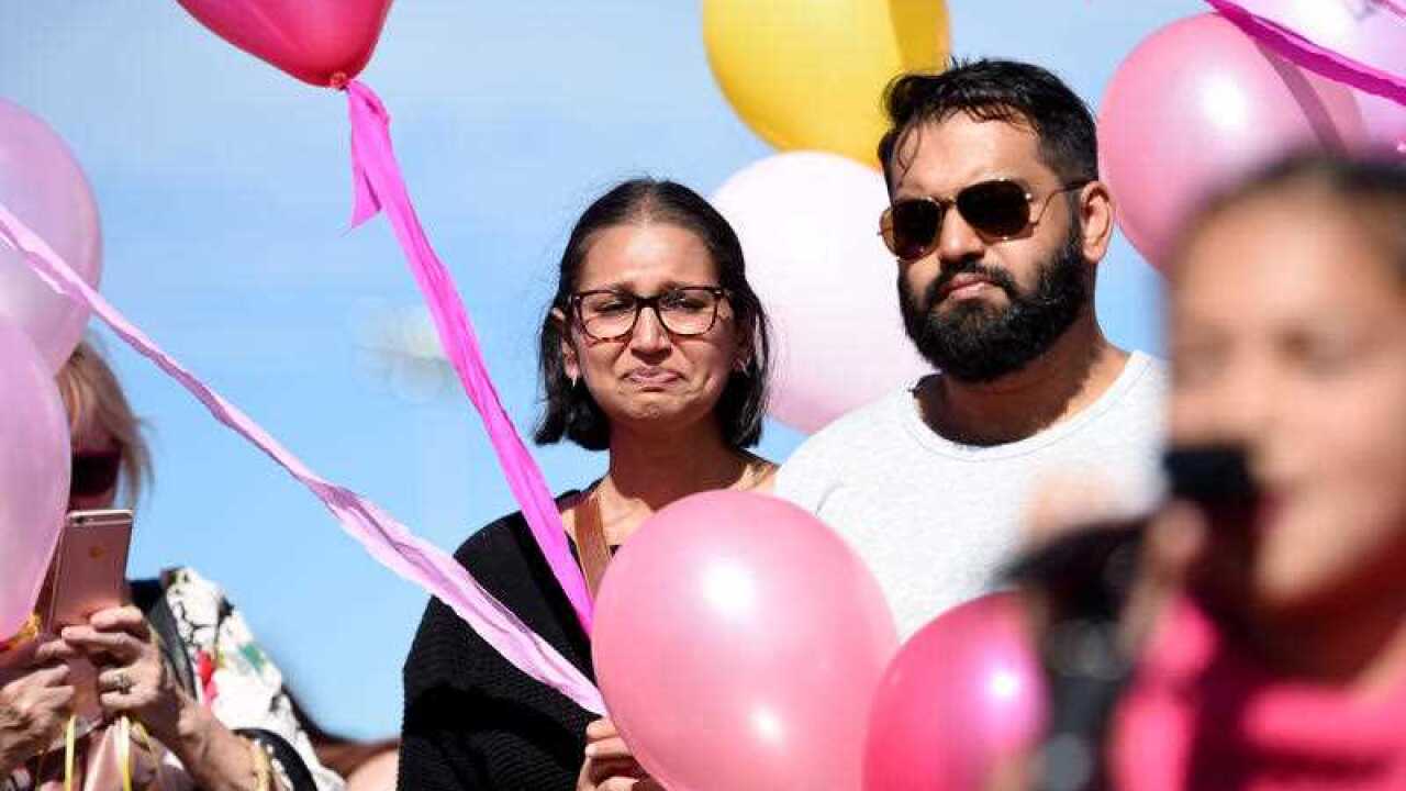 The uncle of murdered 14 month old Sanaya Sahib Jameel Ahamad joins mourners as they release balloons at a community vigil.