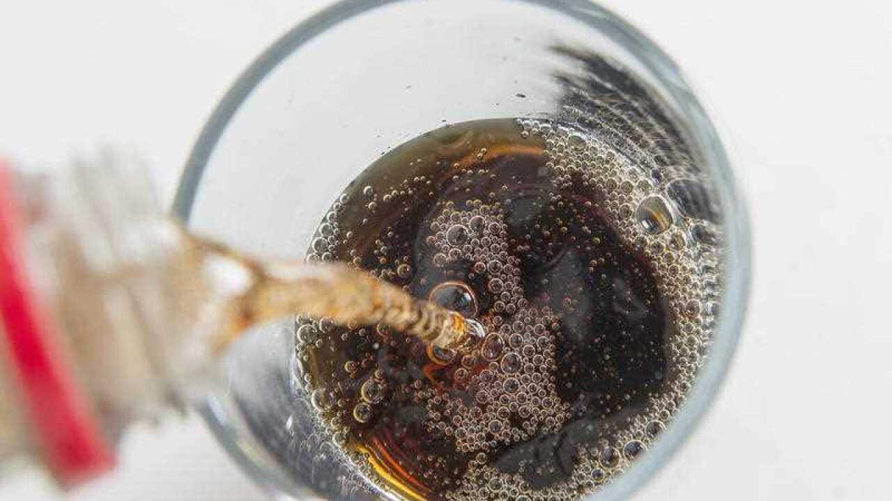 File photo dated 22/7/2015 of a cola carbonated drink being poured.