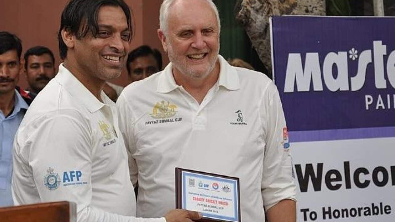 akistani fast bowler Shoaib Akhtar shakes hands with Australia’s High Commissioner to Pakistan Peter Heyward
