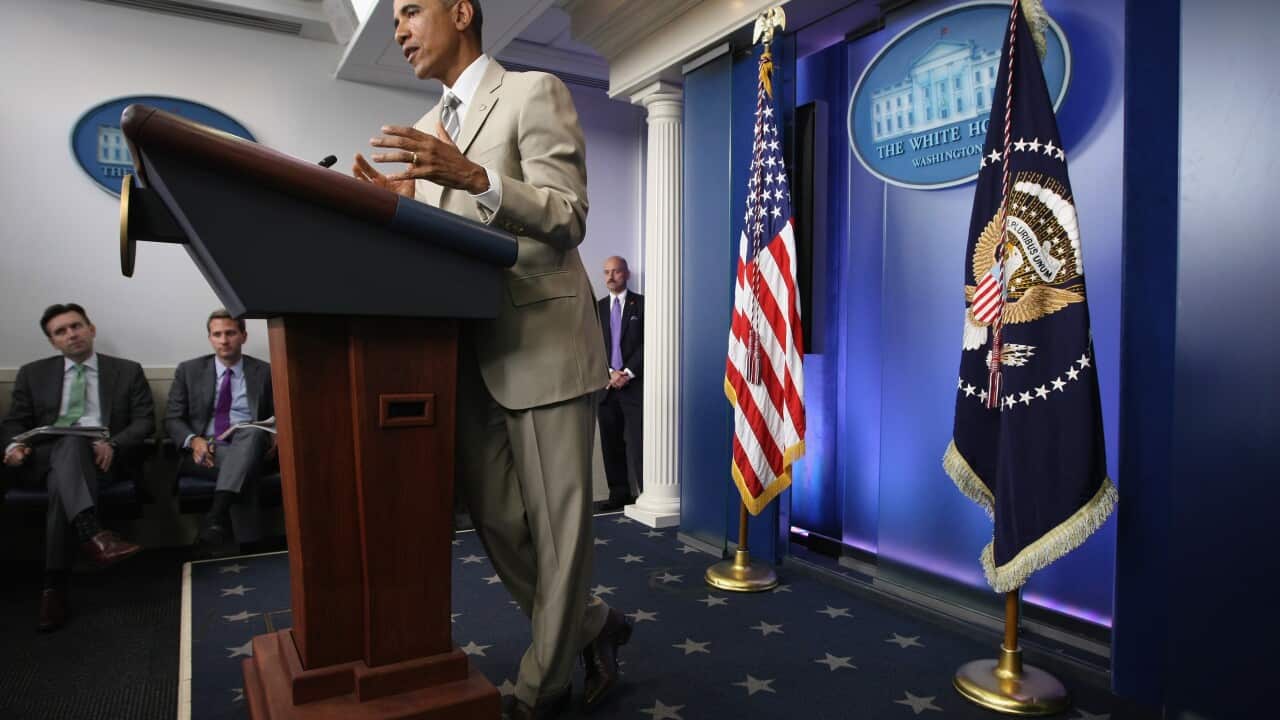 US President Barack Obama wearing a tan suit