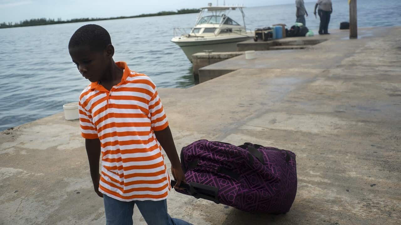 A family is evacuated in the Bahamas.