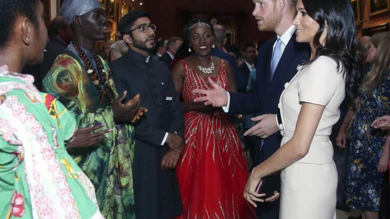 Prince Harry and Meghan chat with some of the guests