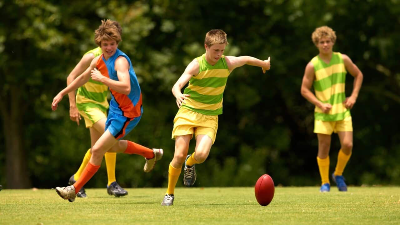 Teens playing footy-Cameron Spencer- Getty Images