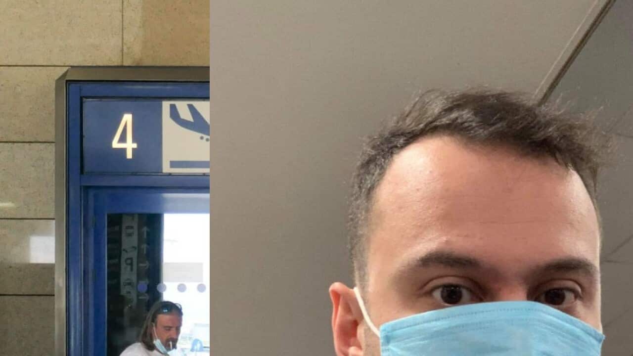 man at airport hall wearing face mask - (background) Passengers seen with the obligatory face masks at Athens International Airport