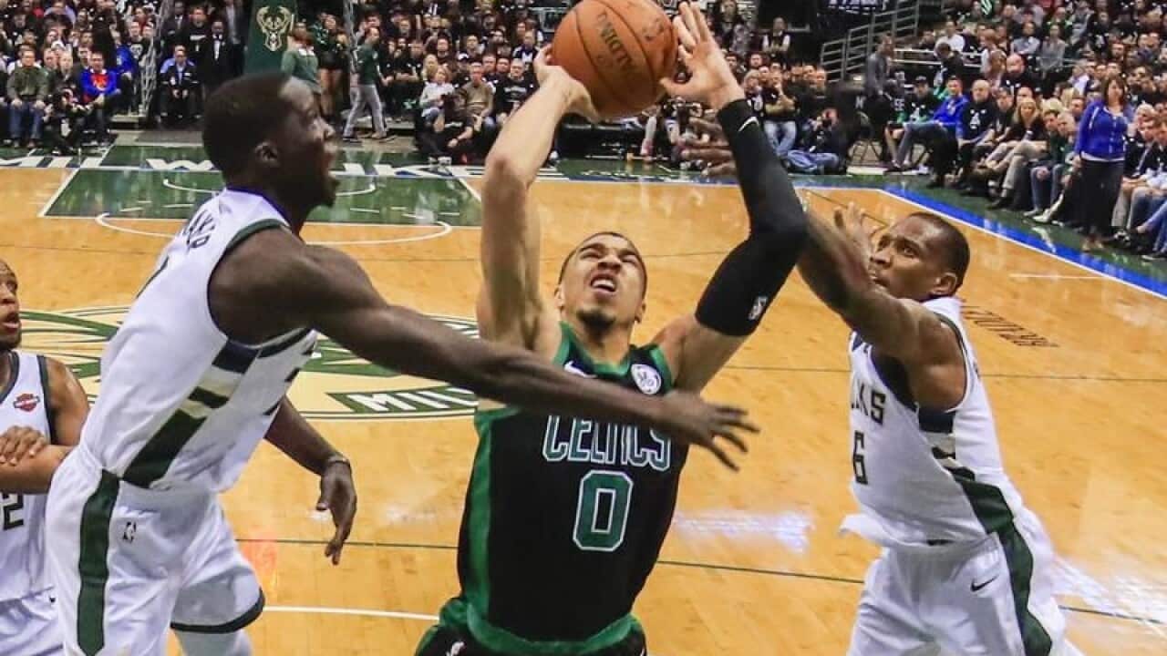 Milwaukee Bucks Thon Maker blocks Boston Celtics Jayson Tatum's shot.