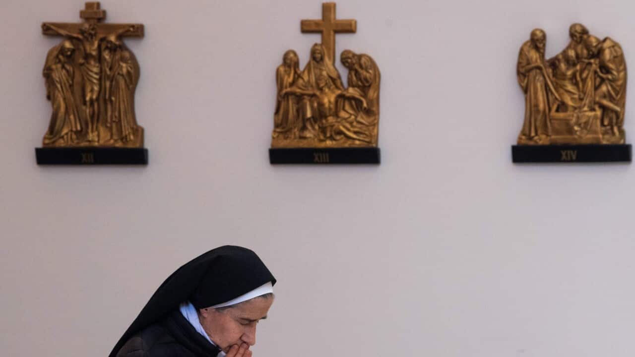 A nun prays during a mass for peace in Ukraine in the Macedonian Catholic church 'Sacred heart of Jesus' in Skopje.