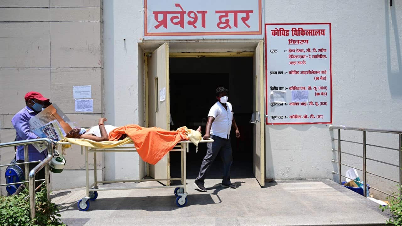 Family members along with medical workers shift a COVID19 patient to Level-3 ward of Swaroop Rani Nehru hospital in Prayagraj