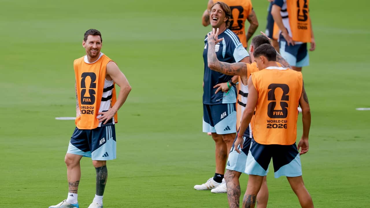 Lionel Messi in a singlet and shorts training with Argentina players