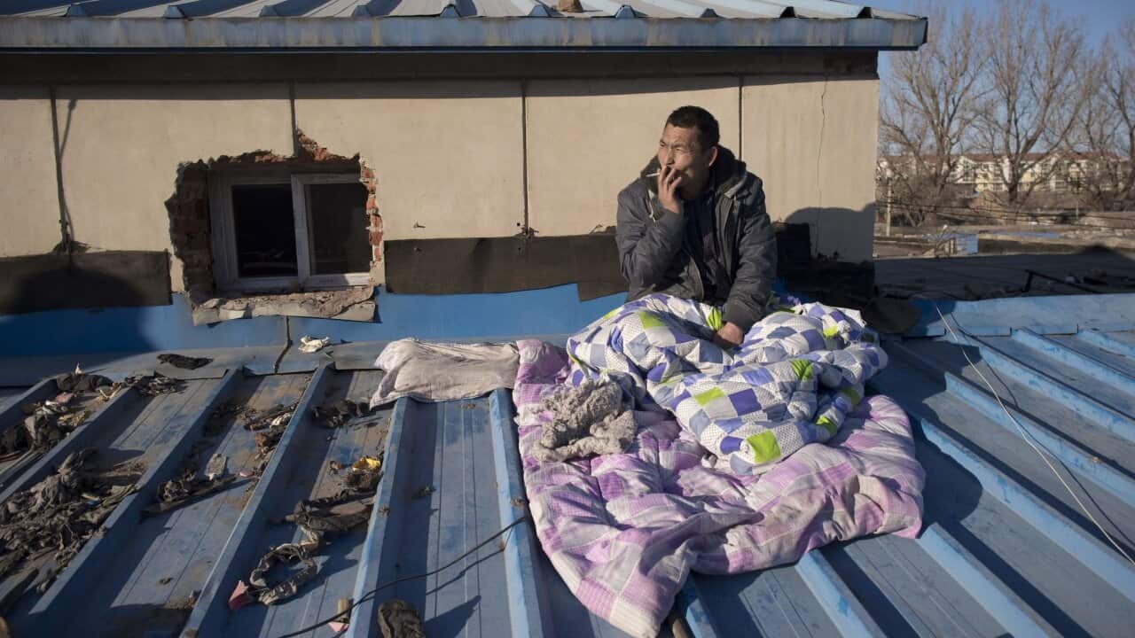 A migrant worker last month after being evicted from a low-income housing area near Beijing. He returned home to his village in rural southern China.