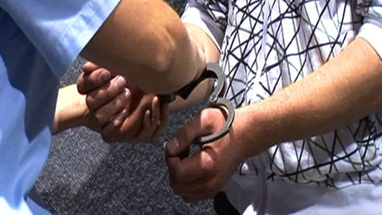 handcuffs_arrest_police_2603_B_aap_71879118