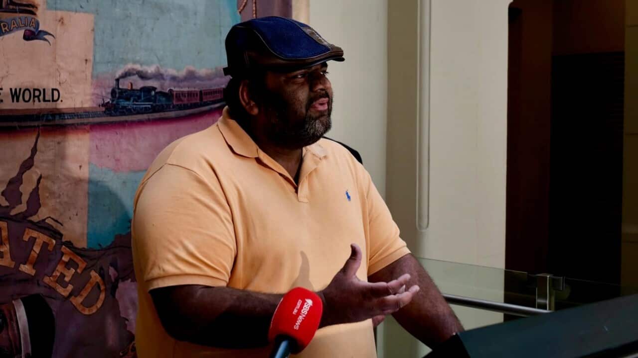 Man speaking at a press conference