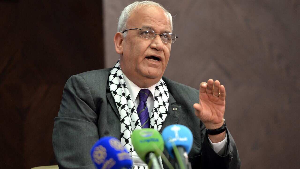 The Chief of the Palestinian Liberation Organisation's (PLO), Saeb Muhammad Salih Erekat, delivers a lecture a at the National Library in Kuwait City, 2014.