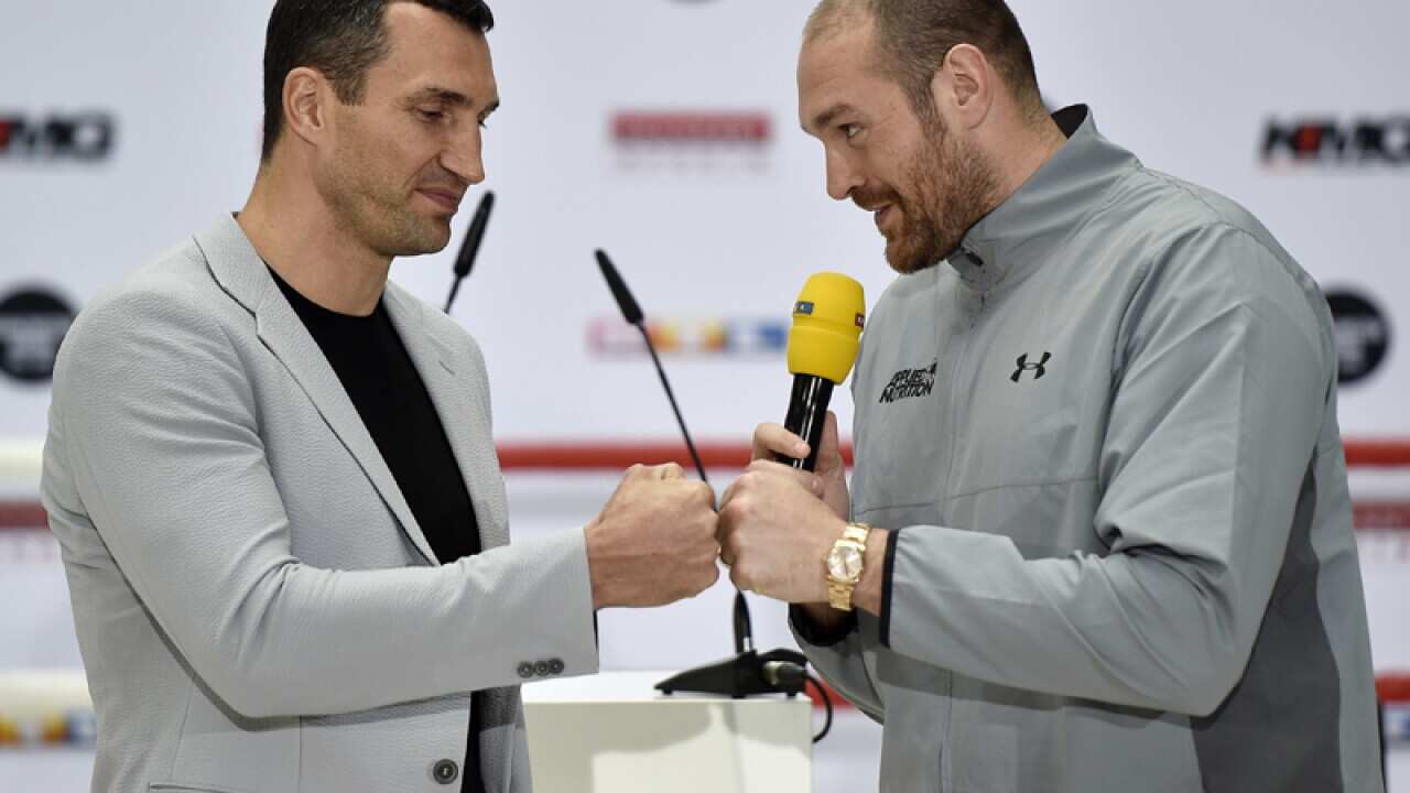 Heavyweight boxers Tyson Fury (R) and Wladimir Klitschko
