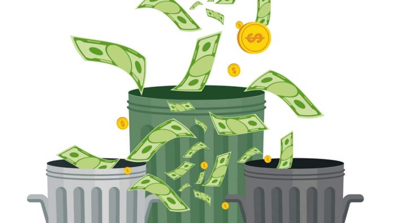wasting money into bin