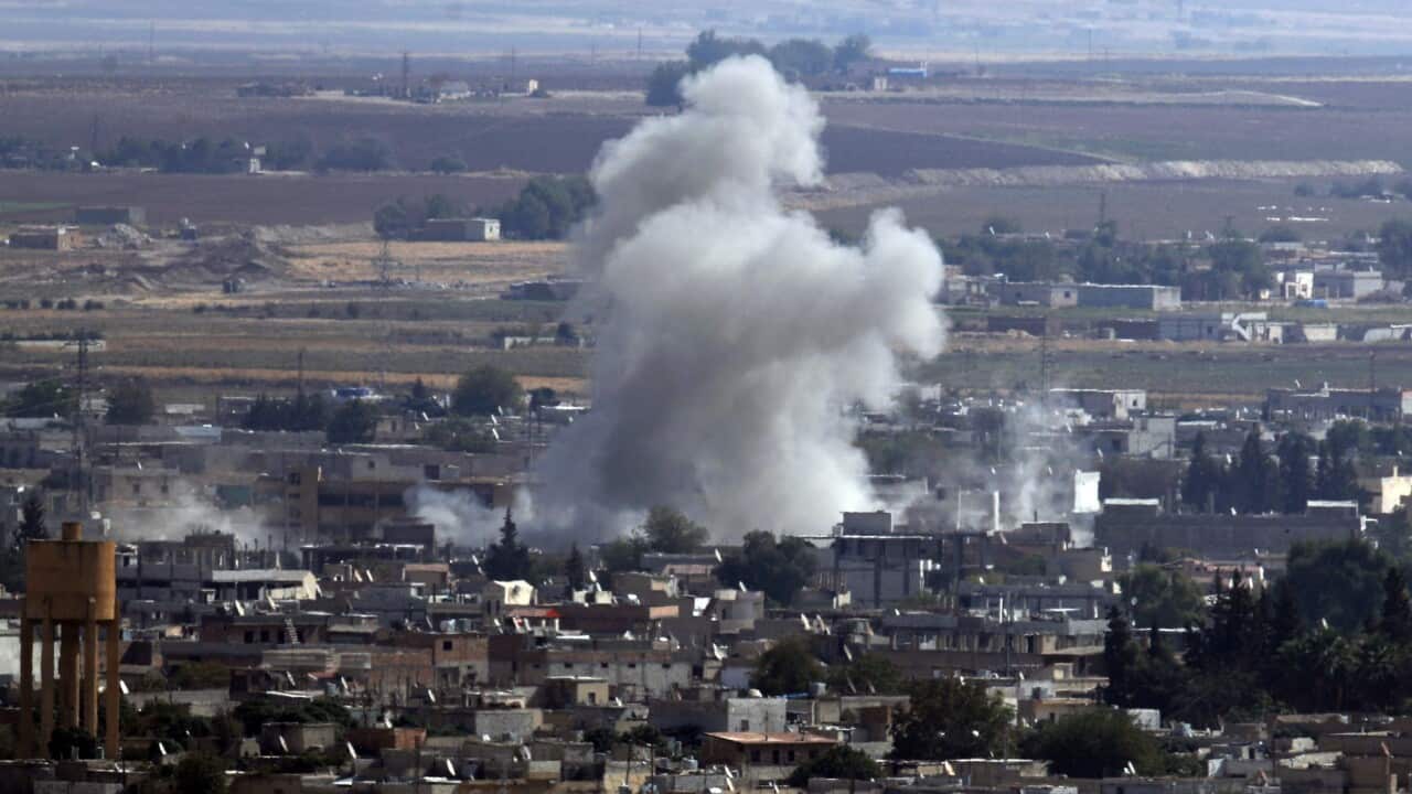 Smoke and dust billows from targets in Ras al-Ayn, Syria, caused by bombardment by Turkish forces, Tuesday, Oct. 15, 2019.