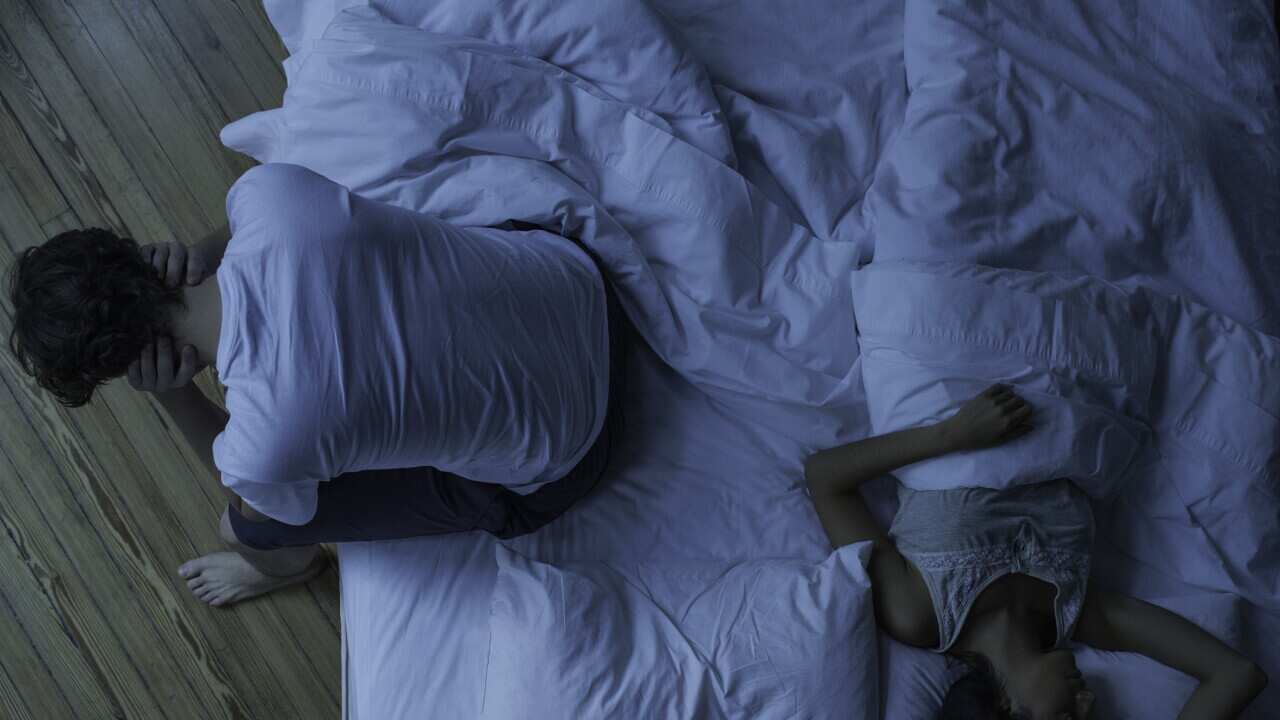 Man unable to sleep while wife sleeps comfortably unaware