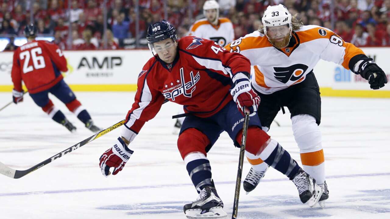 Washington Capitals' Tom Wilson (43) with Philadelphia's Jakub Voracek