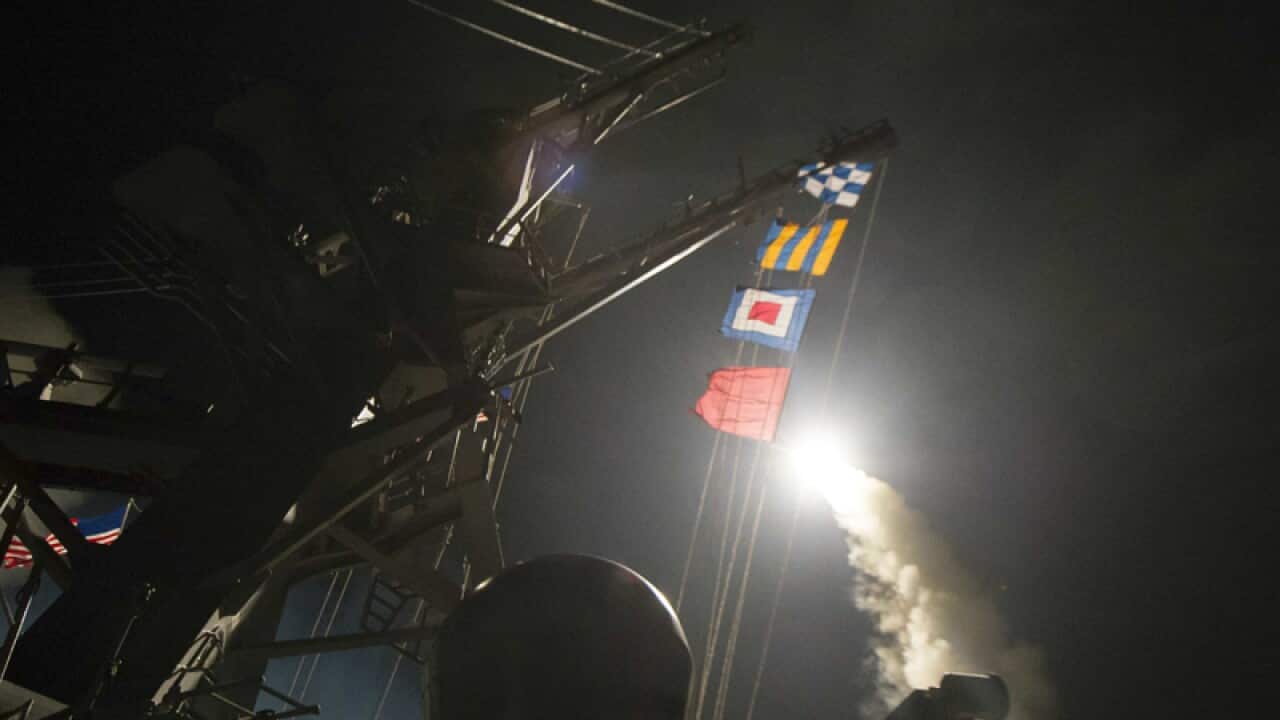The USS Ross fires a tomahawk land attack missile