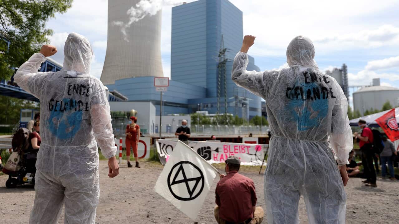 Demonstrators stage a protest against climate change.