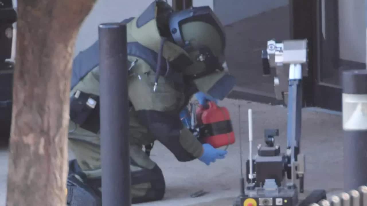 Bomb squad detective investigate a suspicious device placed outside Frankston Magistrates Court.