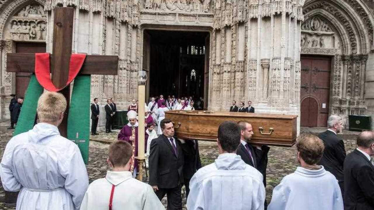 The coffin of priest Jacques Hamel is carried out of the Notre Dame cathedral after a funeral ceremony in Rouen, France, 02 August 2016.