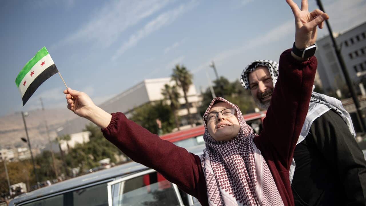 Celebrations in Damascus after rebels capture the city and overthrow al-Assad