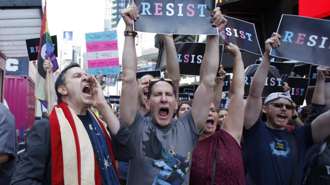 People protest US President Donald Trump's announcement that transgender people will not be allowed to serve in the US military.